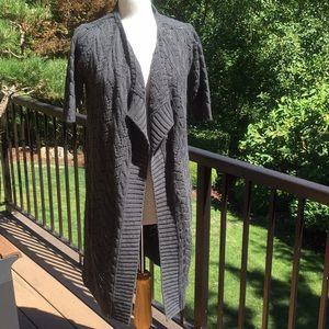 ONE A woman’s long sweater